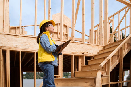 Female builder wearing hard hat
