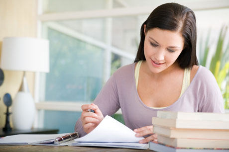 Woman Looking Over Paperwork