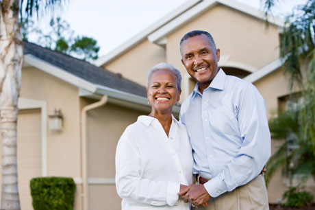 Older Couple In Front Of House Older Couple In Front Of House